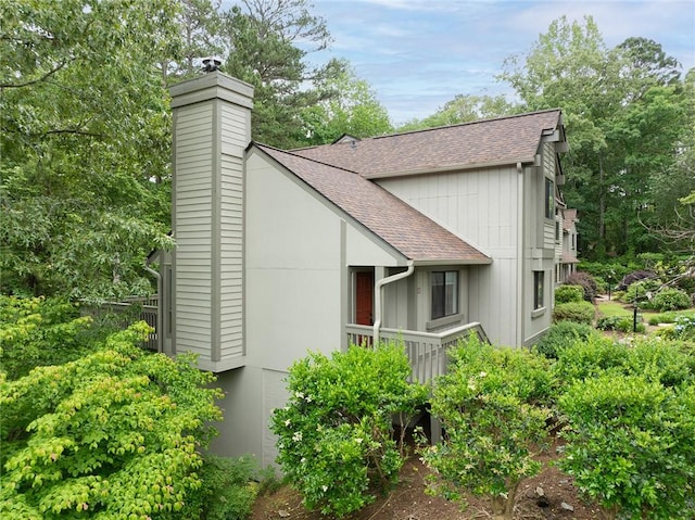 110 Safe Harbor Cir, Salem, SC 29676 - view of home's exterior with a shingled roof and a chimney