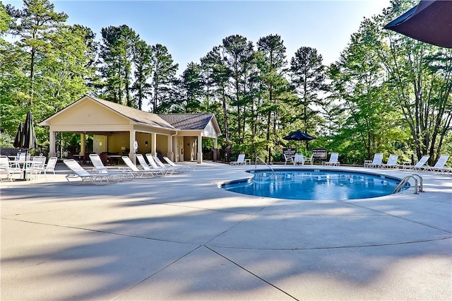 110 Safe Harbor Cir, Salem, SC 29676 - community pool featuring a patio area, fence, and view of scattered trees