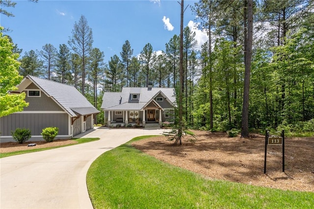 113 Settlement Village Dr, Sunset, SC 29685 - view of front facade featuring curved driveway, a porch, metal roof, and board and batten siding