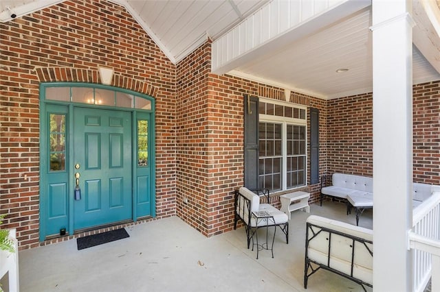 entrance to property with brick siding