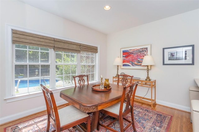 dining area featuring plenty of natural light, wood finished floors, baseboards, and recessed lighting