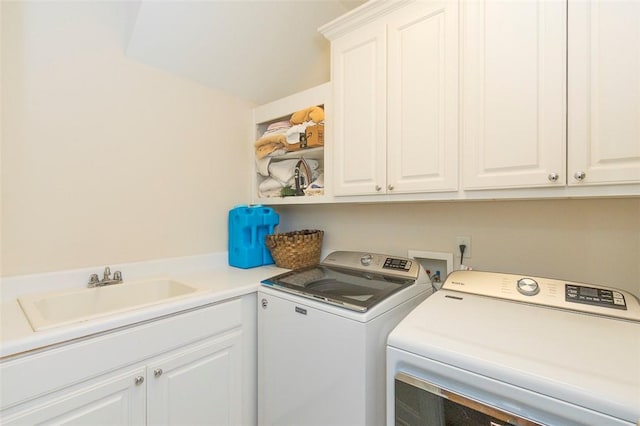 laundry room featuring cabinet space and washer and clothes dryer