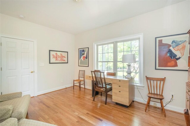 office featuring light wood-style flooring and baseboards