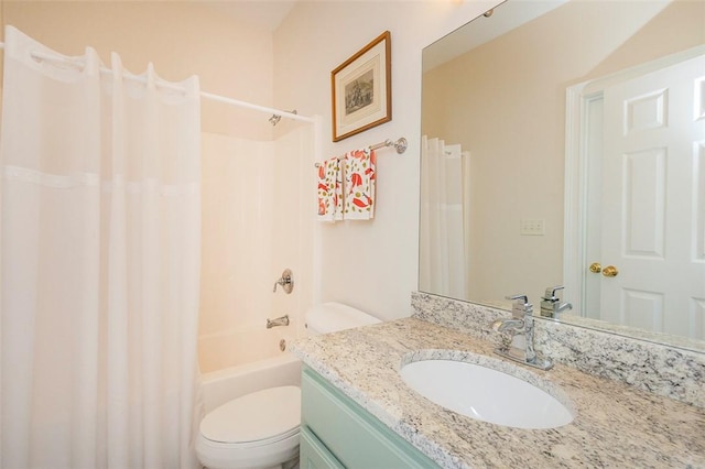 full bath featuring toilet, vanity, and shower / bath combo with shower curtain