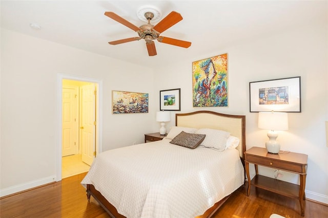 bedroom with wood finished floors, baseboards, and ceiling fan