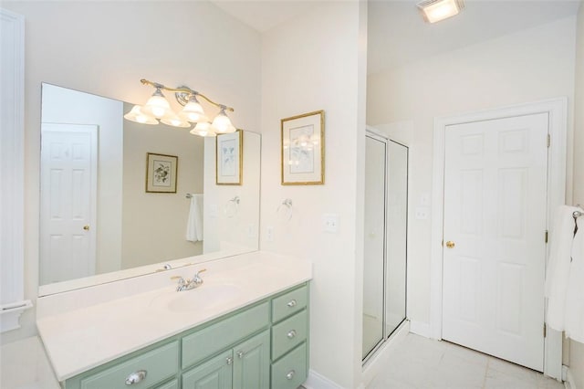 bathroom featuring a stall shower, vanity, and tile patterned floors