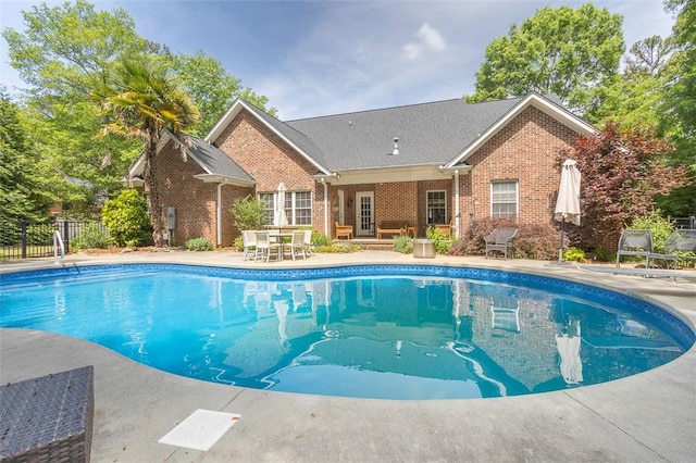 view of pool featuring a patio area and fence