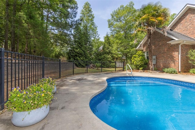 view of pool featuring fence