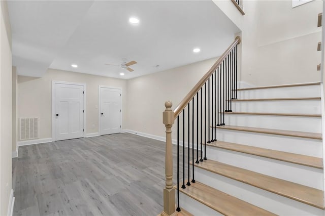 3062 Woodale Cir, Seneca, SC 29678 - stairs featuring ceiling fan, wood finished floors, baseboards, and recessed lighting