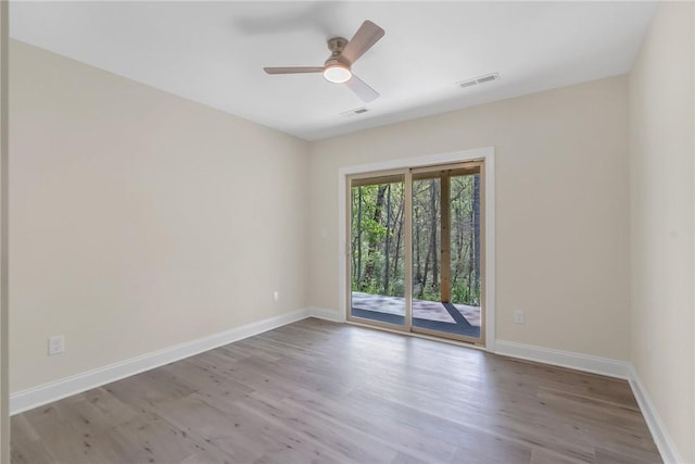 3062 Woodale Cir, Seneca, SC 29678 - empty room with wood finished floors, ceiling fan, and baseboards