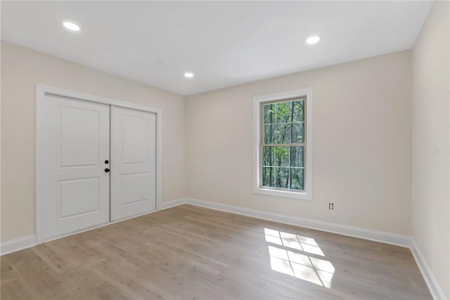 3062 Woodale Cir, Seneca, SC 29678 - unfurnished bedroom featuring light wood-type flooring, baseboards, a closet, and recessed lighting