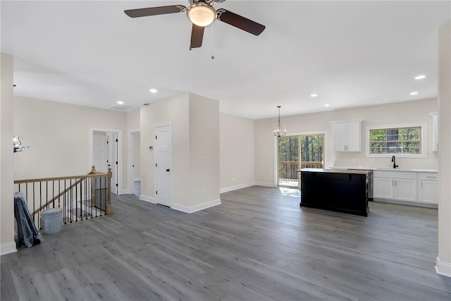 3062 Woodale Cir, Seneca, SC 29678 - unfurnished living room featuring light wood-style flooring, baseboards, and recessed lighting