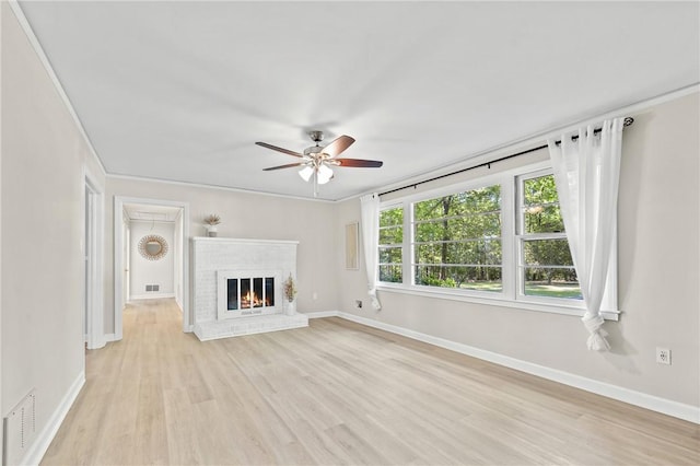 1102 Garrison Rd, Anderson, SC 29625 - unfurnished living room with ceiling fan, light wood finished floors, baseboards, and a fireplace