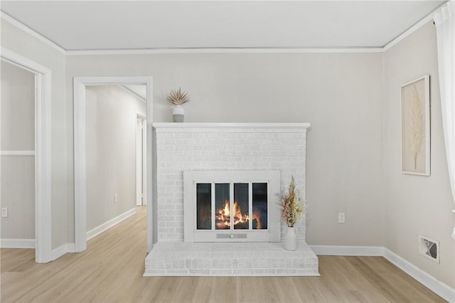 1102 Garrison Rd, Anderson, SC 29625 - detailed view of wood finished floors, ornamental molding, baseboards, and a fireplace