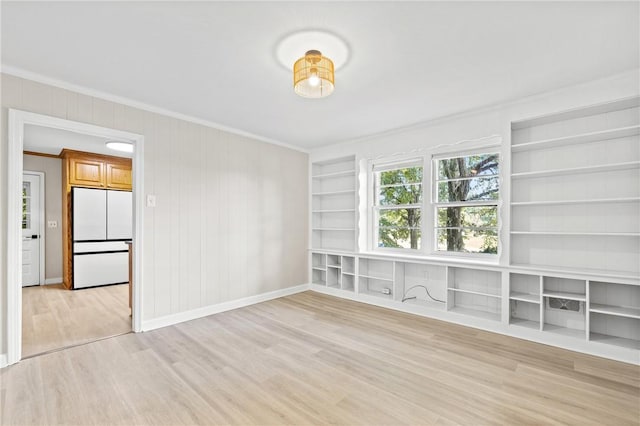 1102 Garrison Rd, Anderson, SC 29625 - spare room with ornamental molding, built in features, light wood-style floors, baseboards, and wooden walls