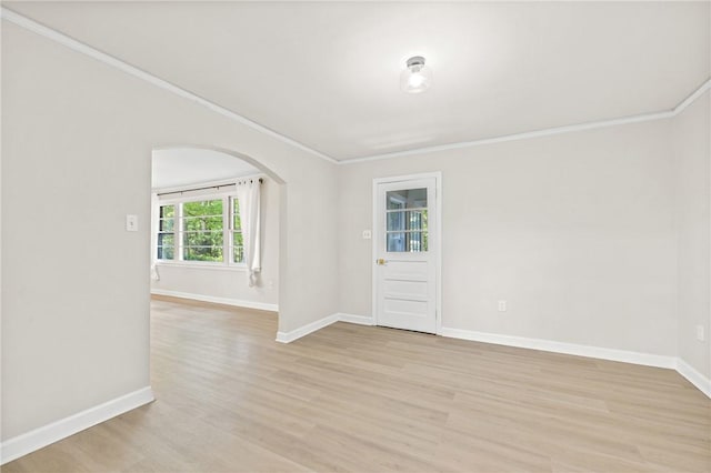 1102 Garrison Rd, Anderson, SC 29625 - unfurnished room with arched walkways, ornamental molding, light wood-style flooring, and baseboards