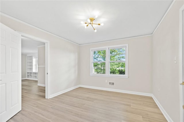 1102 Garrison Rd, Anderson, SC 29625 - empty room featuring light wood-style floors, baseboards, ornamental molding, and a chandelier
