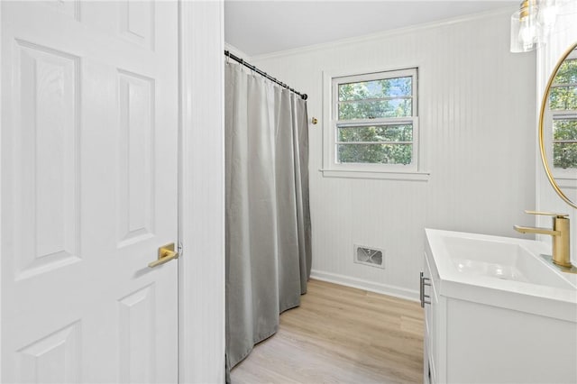 1102 Garrison Rd, Anderson, SC 29625 - full bath featuring crown molding, vanity, healthy amount of natural light, wood finished floors, and baseboards