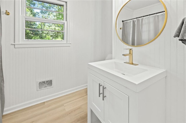1102 Garrison Rd, Anderson, SC 29625 - full bathroom with vanity, wood finished floors, crown molding, and baseboards