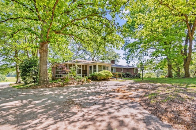 1102 Garrison Rd, Anderson, SC 29625 - single story home with a sunroom and a chimney
