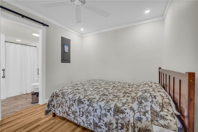 619 Crossland Creek Ct, Tamassee, SC 29686 - bedroom with electric panel, wood finished floors, a barn door, crown molding, and connected bathroom