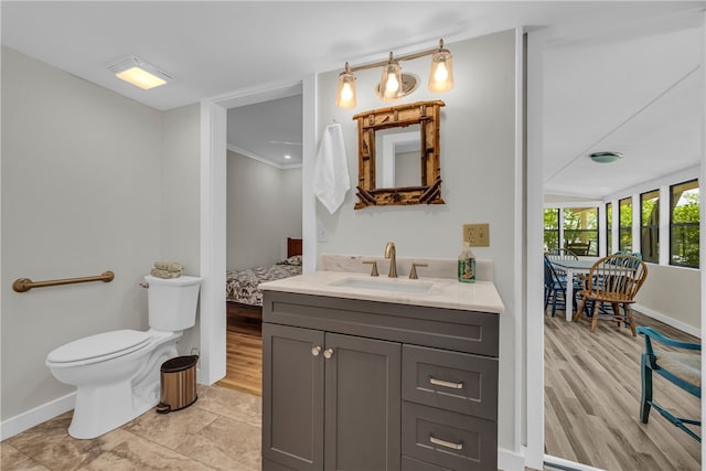 619 Crossland Creek Ct, Tamassee, SC 29686 - bathroom featuring baseboards, toilet, vanity, ensuite bath, and wood finished floors