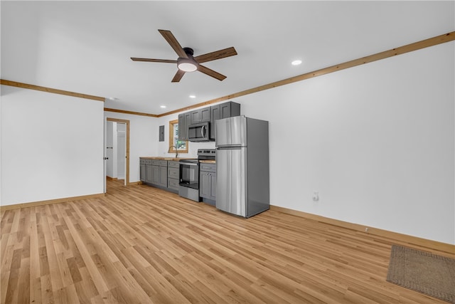 621 Crossland Creek Ct, Tamassee, SC 29686 - kitchen with appliances with stainless steel finishes, gray cabinetry, a ceiling fan, baseboards, and crown molding