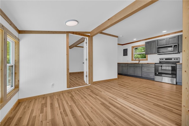 621 Crossland Creek Ct, Tamassee, SC 29686 - kitchen featuring stainless steel appliances, baseboards, light wood-style floors, gray cabinets, and ornamental molding