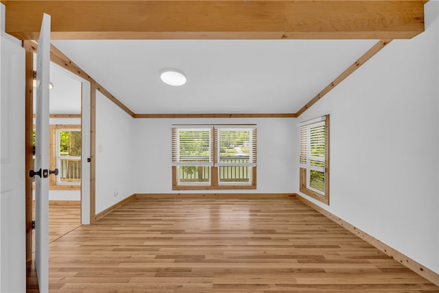 621 Crossland Creek Ct, Tamassee, SC 29686 - empty room featuring light wood-style flooring, lofted ceiling, ornamental molding, and baseboards