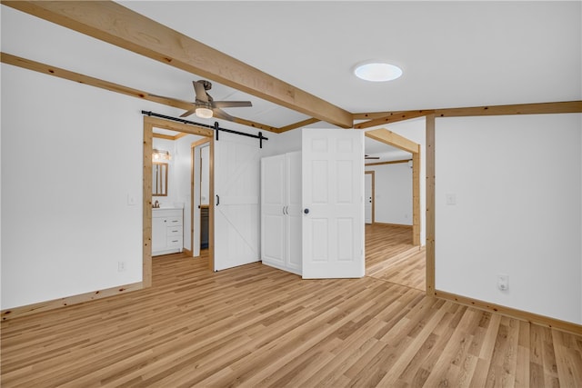 621 Crossland Creek Ct, Tamassee, SC 29686 - unfurnished bedroom featuring beam ceiling, light wood finished floors, a barn door, baseboards, and ensuite bath