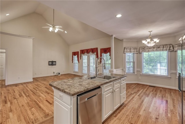 kitchen featuring dishwasher, a sink, a ceiling fan, white cabinetry, and light wood-style flooring