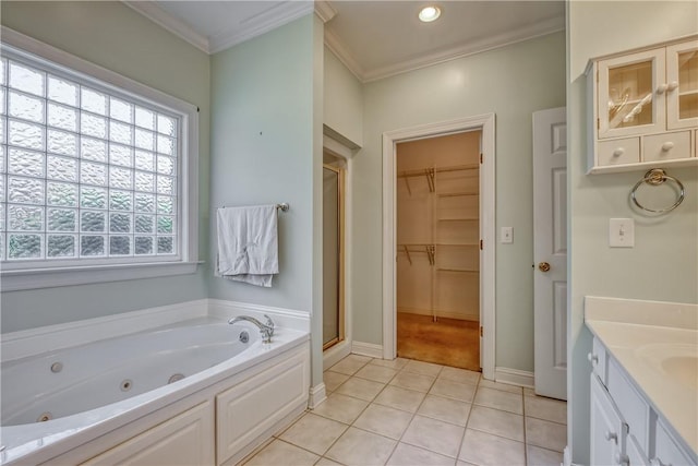 bathroom featuring a shower stall, ornamental molding, a tub with jets, tile patterned floors, and baseboards