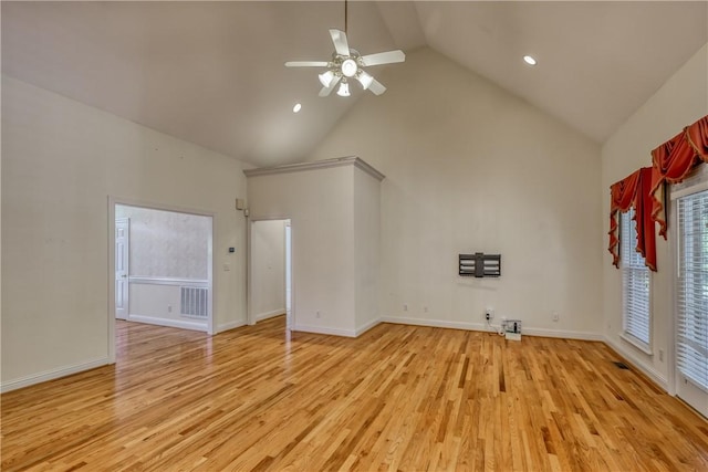 unfurnished living room with high vaulted ceiling, light wood-type flooring, ceiling fan, recessed lighting, and baseboards