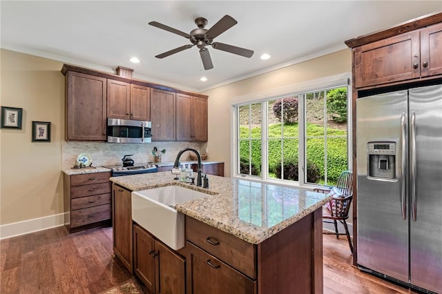 109 Laurel Pond Way, Sunset, SC 29685 - kitchen with stainless steel appliances, a sink, baseboards, crown molding, and dark wood-style floors