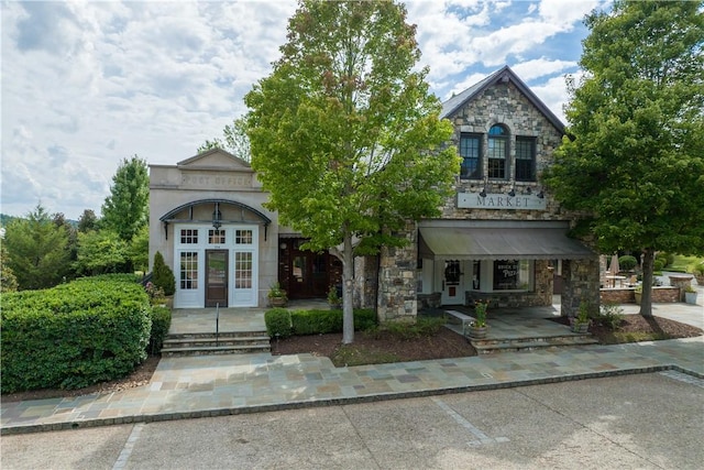 109 Laurel Pond Way, Sunset, SC 29685 - view of front of property featuring stone siding, covered porch, and uncovered parking