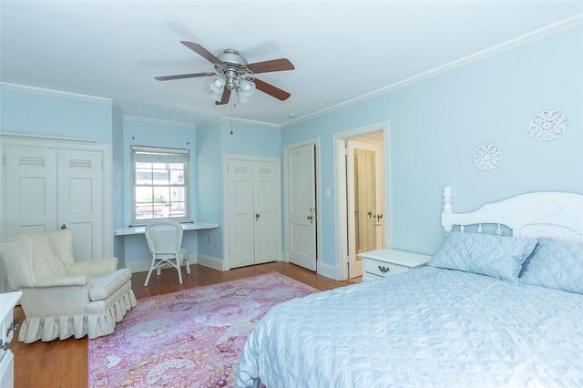605 Boulevard, Anderson, SC 29621 - bedroom with wood finished floors, ornamental molding, ceiling fan, baseboards, and two closets