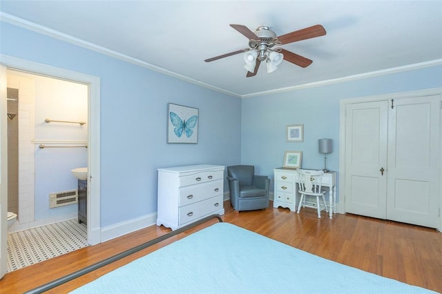 605 Boulevard, Anderson, SC 29621 - bedroom with crown molding, wood finished floors, a closet, baseboards, and a ceiling fan
