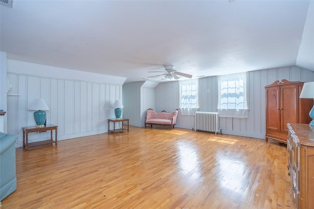 605 Boulevard, Anderson, SC 29621 - additional living space with radiator heating unit, light wood-style flooring, ceiling fan, and a decorative wall
