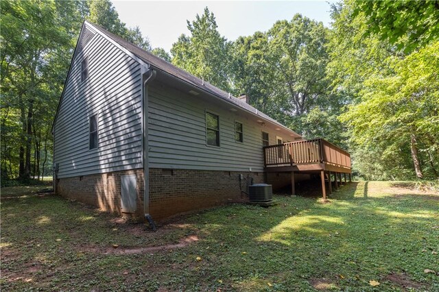 view of property exterior with a deck, a yard, crawl space, and cooling unit