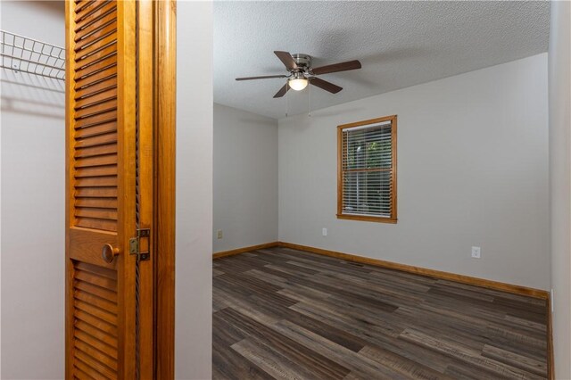 124 S Spring St, Central, SC 29630 - spare room featuring dark wood-style floors, a ceiling fan, and a textured ceiling