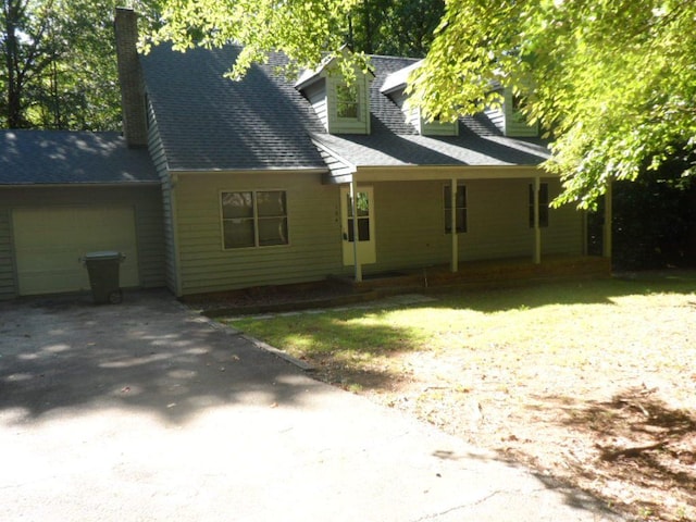 124 S Spring St, Central, SC 29630 - cape cod-style house featuring a garage, driveway, a chimney, and roof with shingles