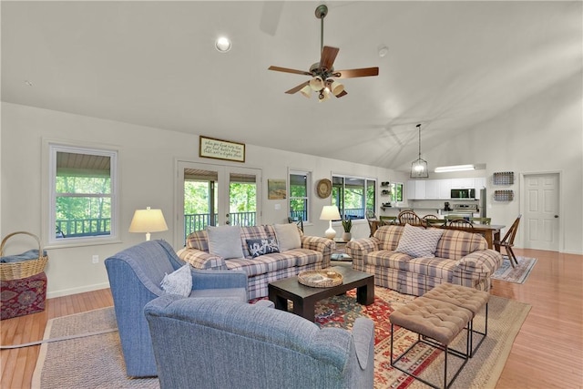 451 Cedar Creek Rd, Sunset, SC 29685 - living room featuring ceiling fan, healthy amount of natural light, light wood-type flooring, high vaulted ceiling, and baseboards