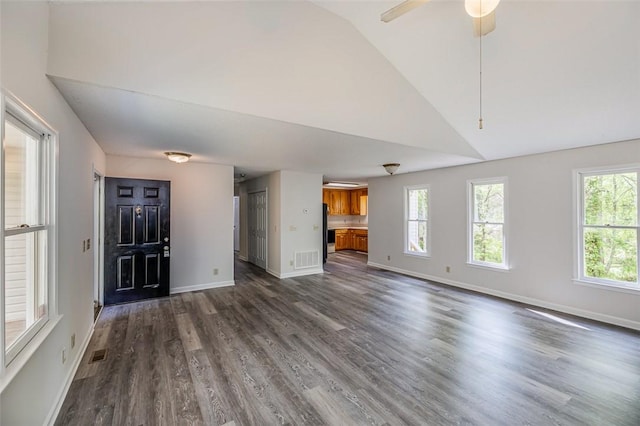 1012 Kens Pl, Taylors, SC 29687 - unfurnished living room with dark wood-type flooring, vaulted ceiling, baseboards, and ceiling fan