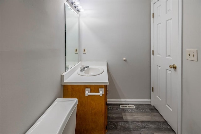 1012 Kens Pl, Taylors, SC 29687 - bathroom featuring wood finished floors, vanity, and baseboards