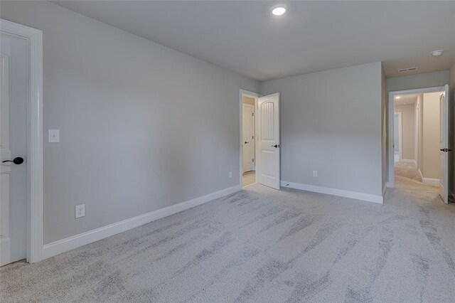 709 Whitemarsh Ave, Simpsonville, SC 29680 - unfurnished bedroom featuring light carpet and baseboards