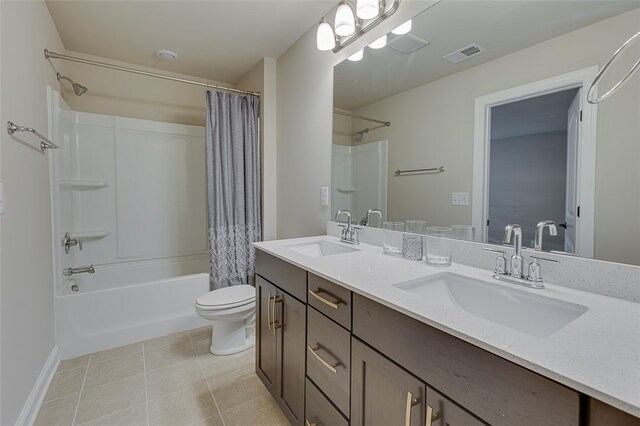 709 Whitemarsh Ave, Simpsonville, SC 29680 - bathroom featuring toilet, tile patterned floors, shower / bath combination with curtain, double vanity, and baseboards