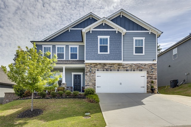 709 Whitemarsh Ave, Simpsonville, SC 29680 - craftsman-style house featuring stone siding, concrete driveway, board and batten siding, a garage, and a front lawn