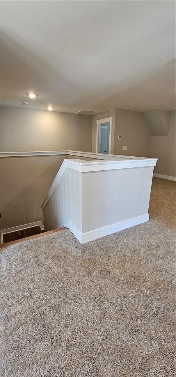 bonus room with carpet floors, baseboards, recessed lighting, and attic access