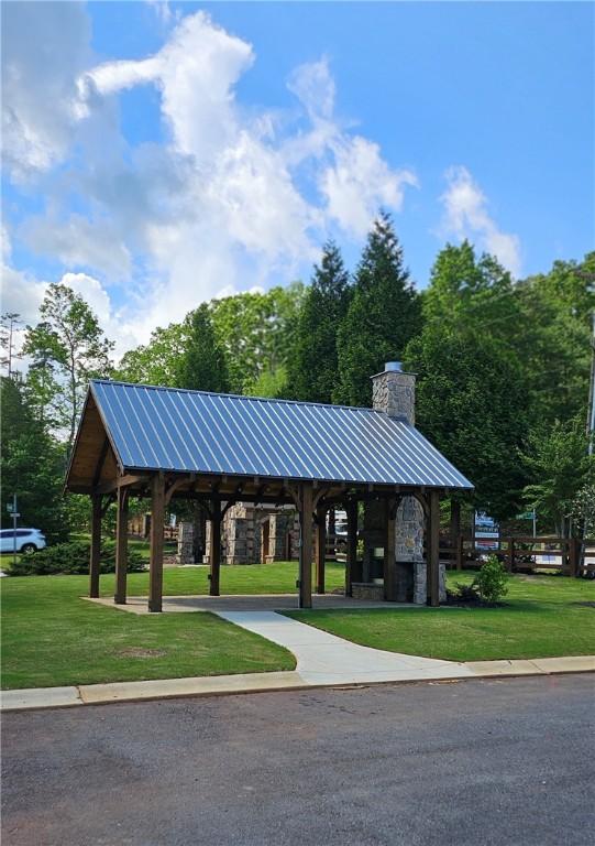 view of home's community with a yard