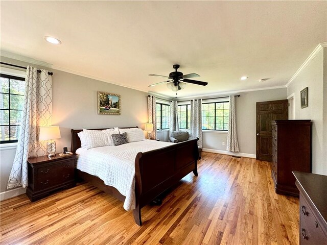 bedroom with ornamental molding, light wood-style flooring, baseboards, recessed lighting, and ceiling fan